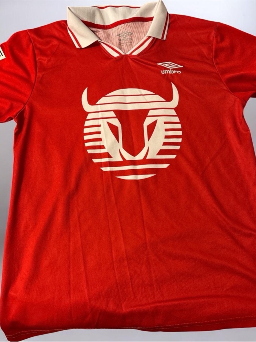 Umbro Red Polo Shirt with Cream Graphic and Collar
